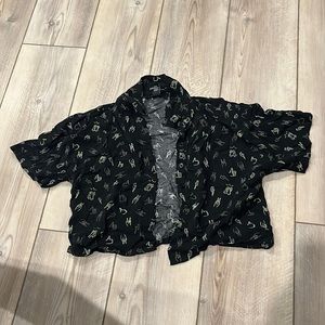 printed black and green button up shirt